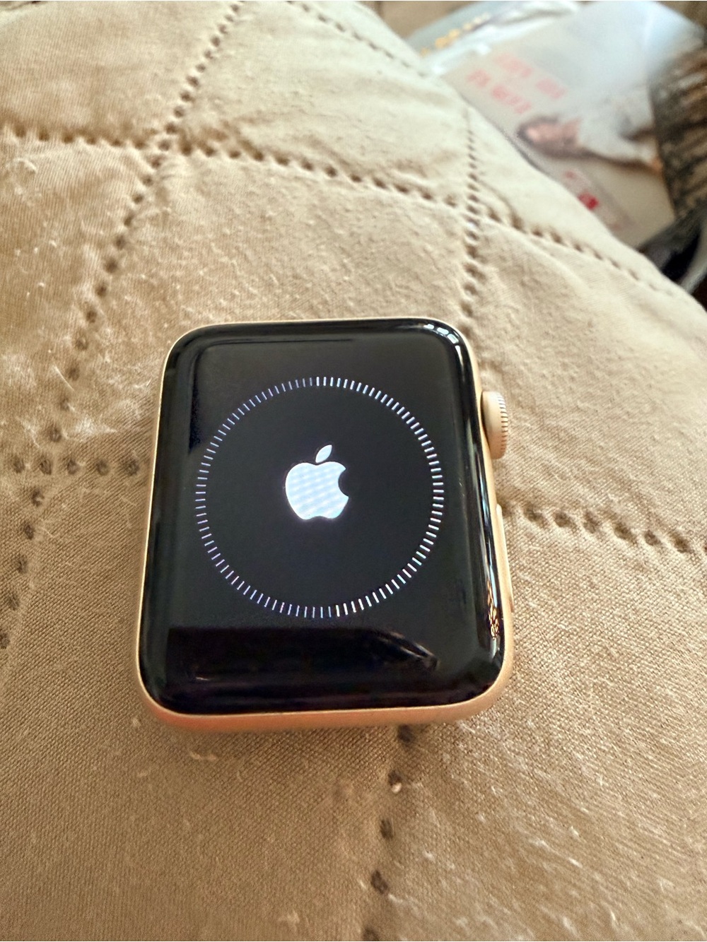 Apple Watch Gold Case with Black Face with two Apple silicone bands.
